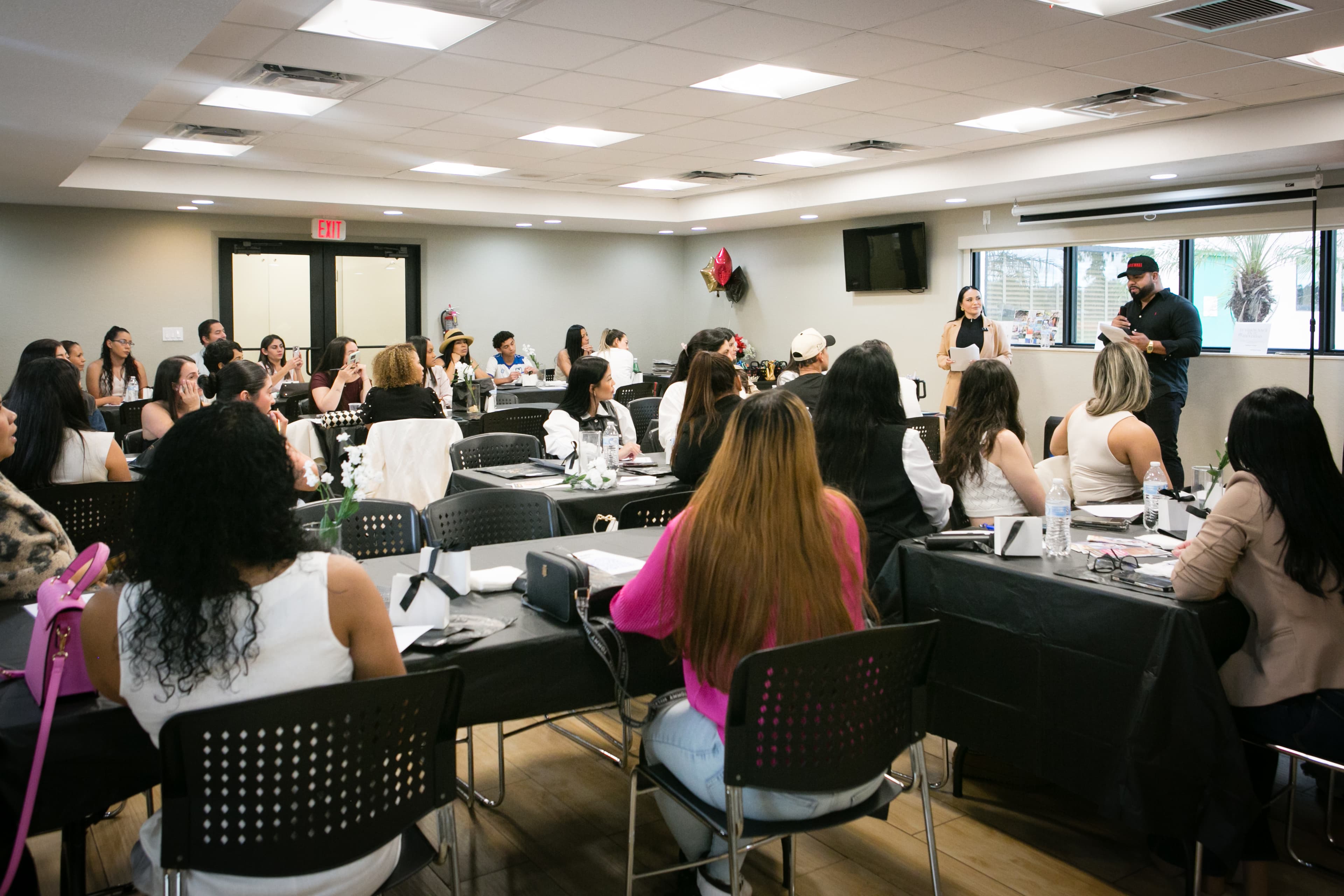 Despierta Tu Poder — Dr. Gissele and Wally addressing the room